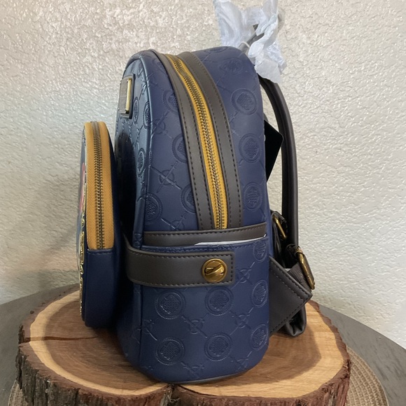belt mini backpack PEBBLE OLIVE GREEN is internally embossed Mini Backpack Purses That Turn